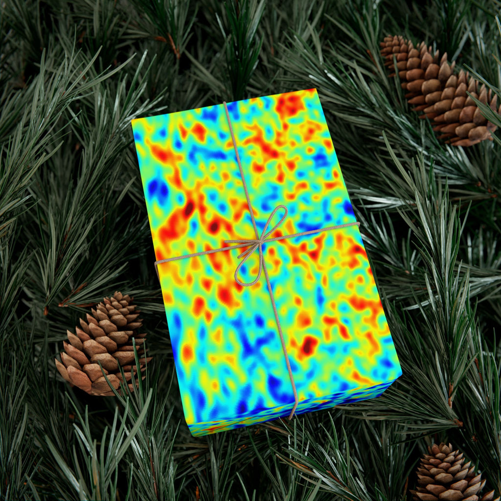 Colorful gift box with a pattern of red, yellow, and blue of the cosmic microwave background on a green leafy background,  