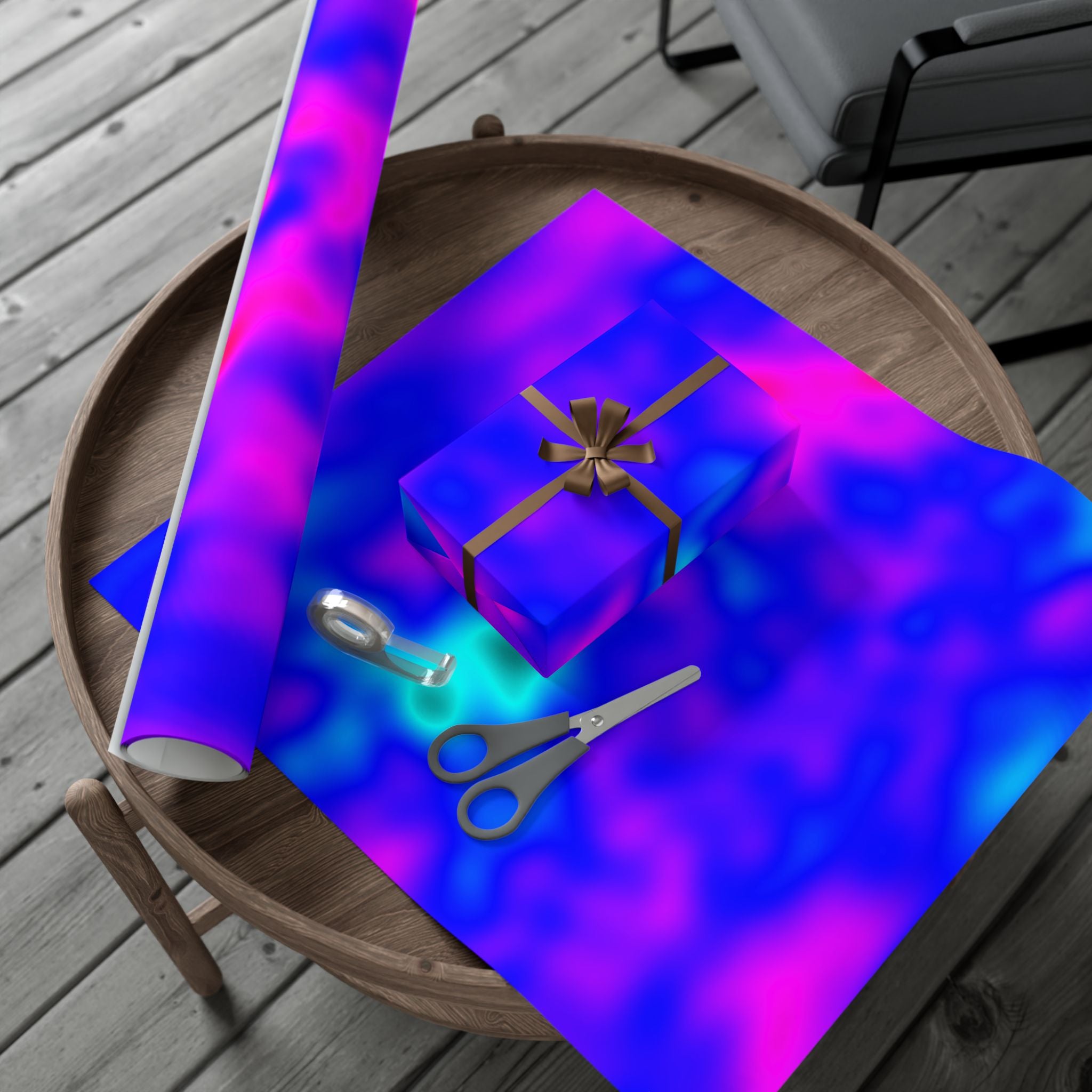 Gift box with a ribbon on a table with colorful paper and scissors.