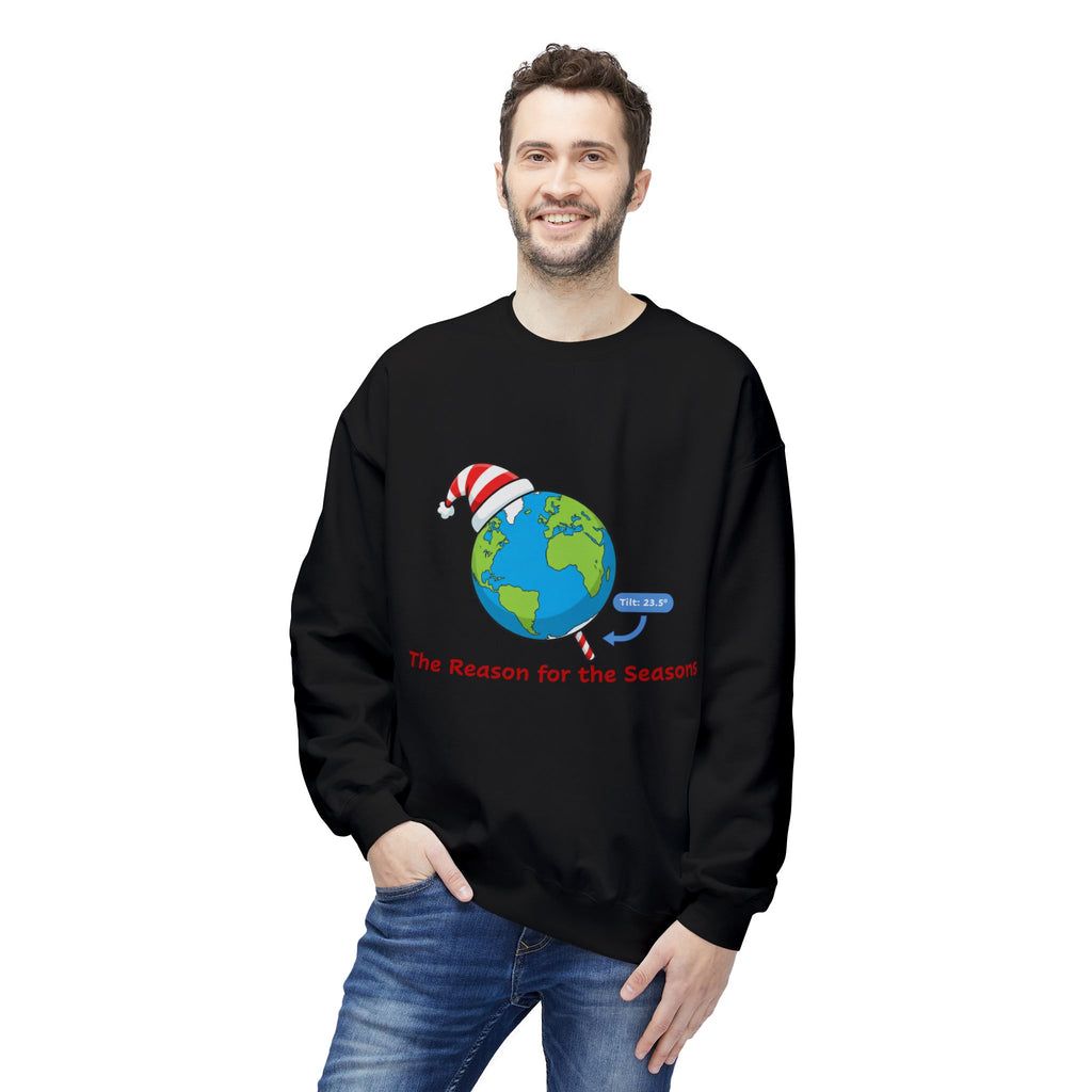 Person wearing a black sweatshirt with a graphic of tilted Earth wearing a Santa hat and text 'The Reason for the Seasons' on a white background. 