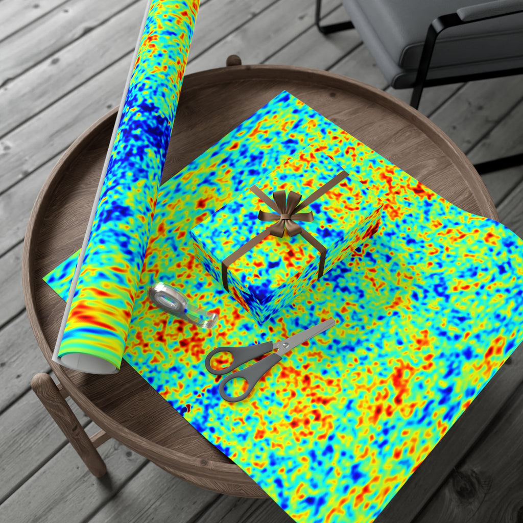 Colorful cosmic microwave background  patterned paper with scissors on a wooden surface